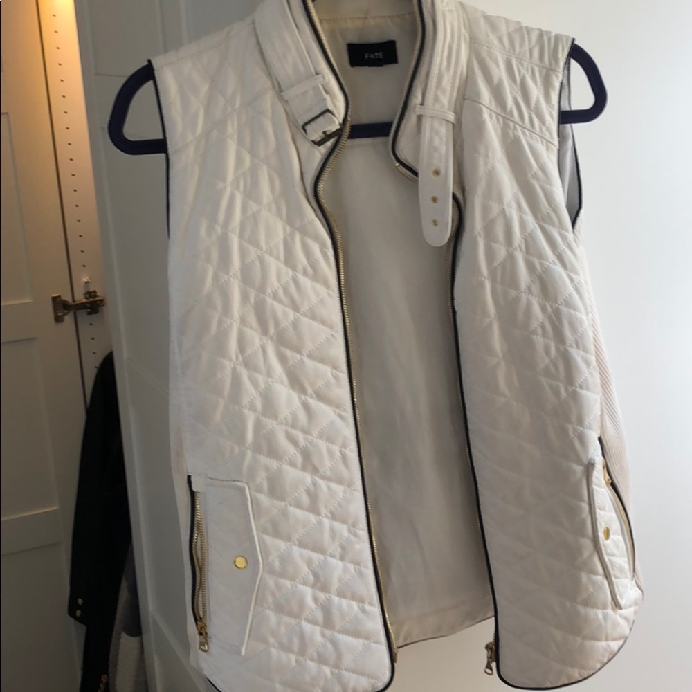 White and black vest